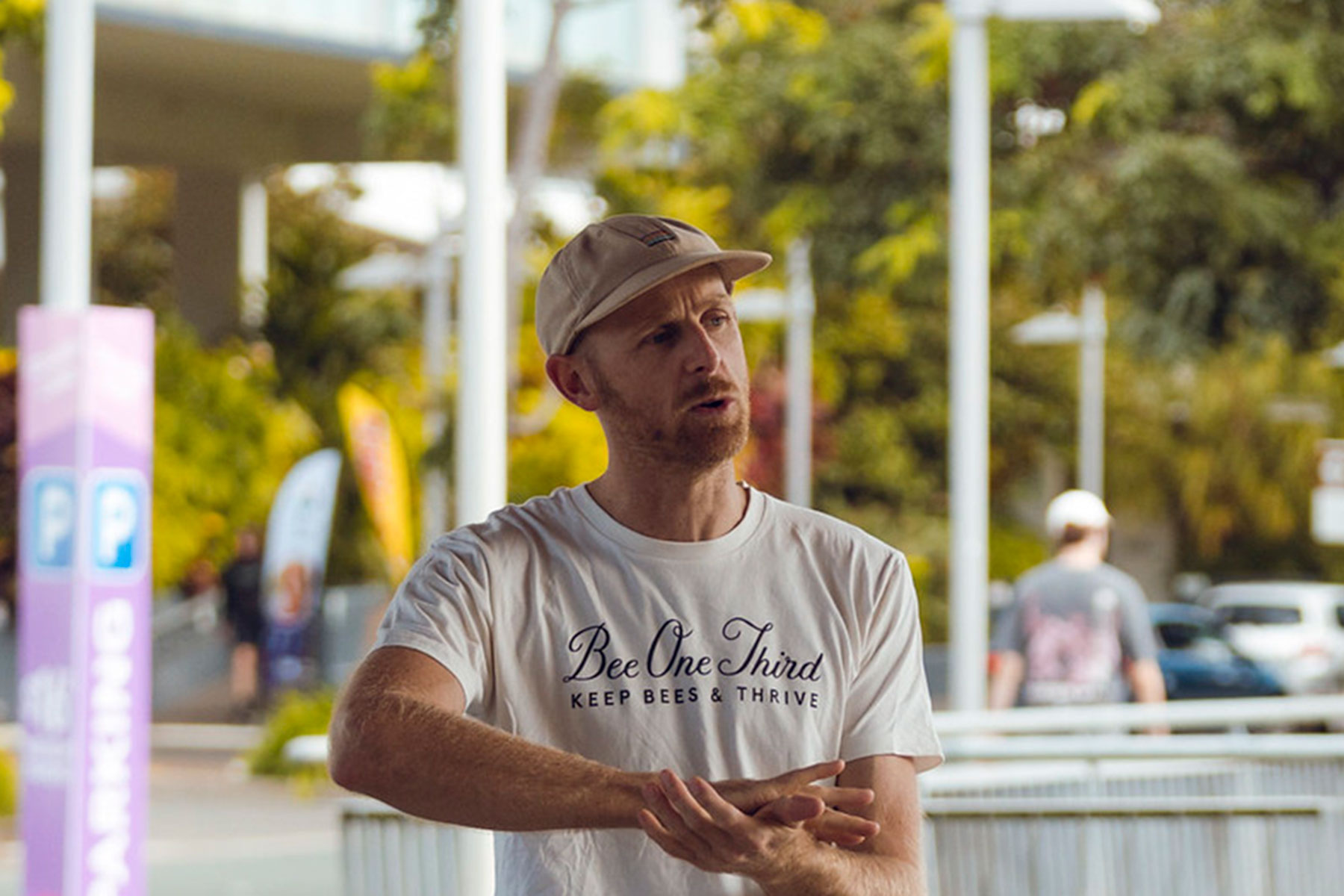 Photo of Jack from Bee One Third wearinf a white tshirt with brand and a cap