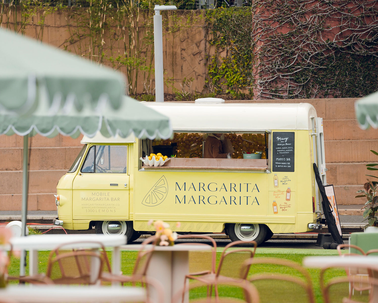 Margarita Margarita light lemon colour yellow food van with text logo on the side